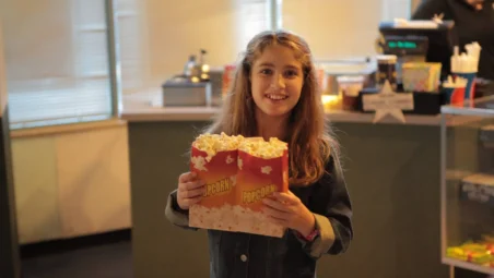 child actress with her popcorn